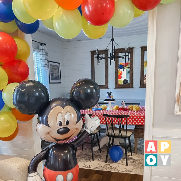mickey mouse balloon in front of balloon garland
