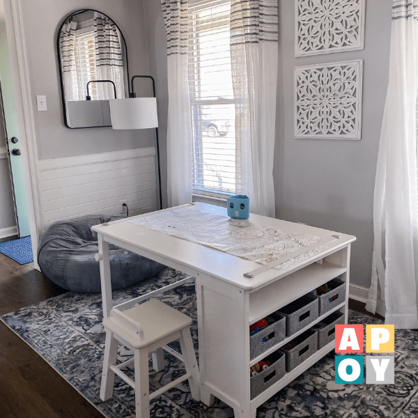white kids learning table and stool in gray room